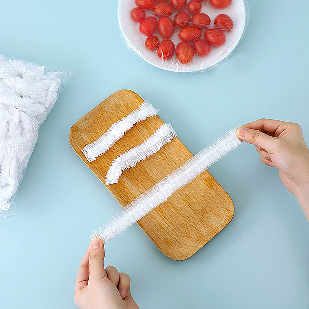A stack of 100 universal disposable clear food covers, perfect for keeping food fresh in the kitchen or on the go.