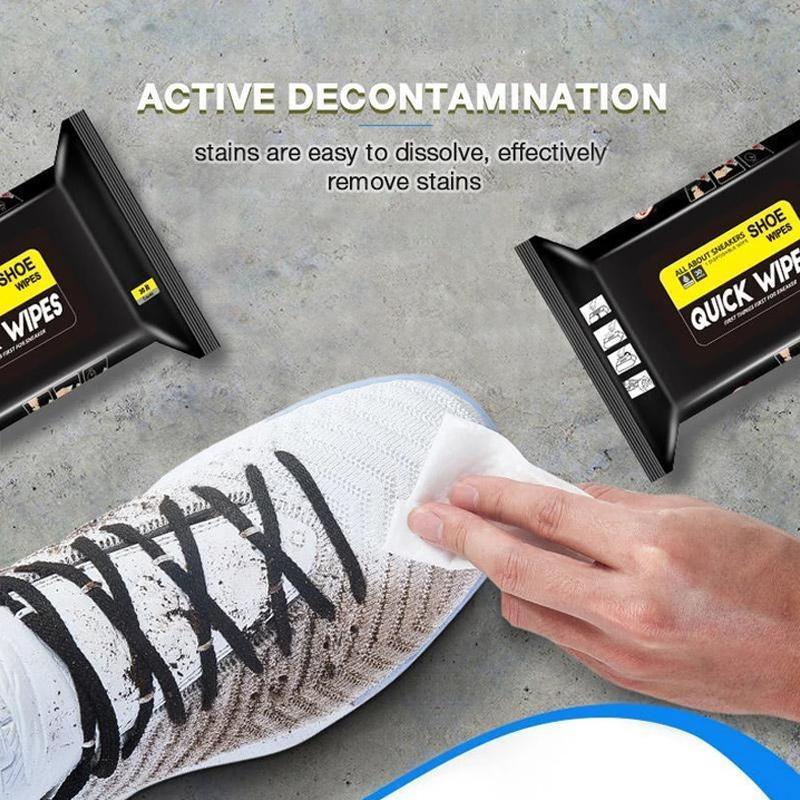 Hand holding a single shoe cleaner wet wipe, ready to use for an instant shoe shine on various materials