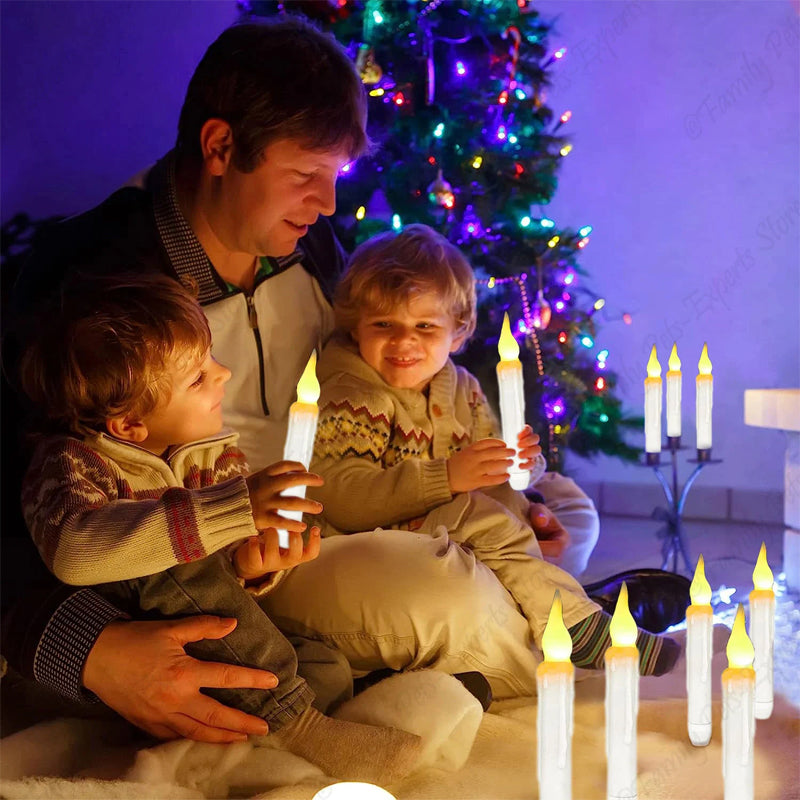 Close-up of a glowing floating LED taper candle, showcasing flickering light and warm glow