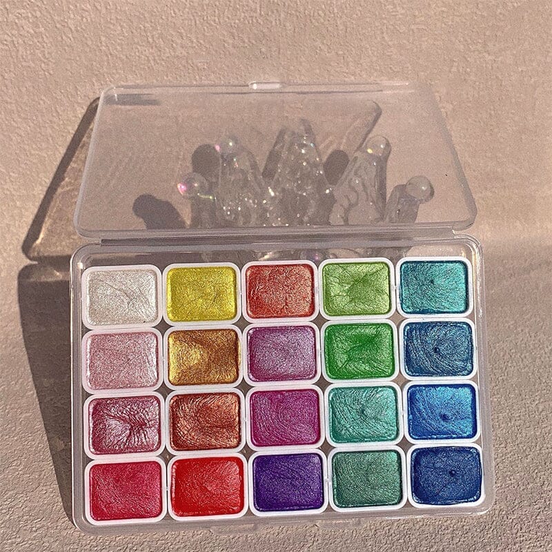 Unboxing a new 20-color metallic watercolor painting set, excitement for creative and beginner art projects.