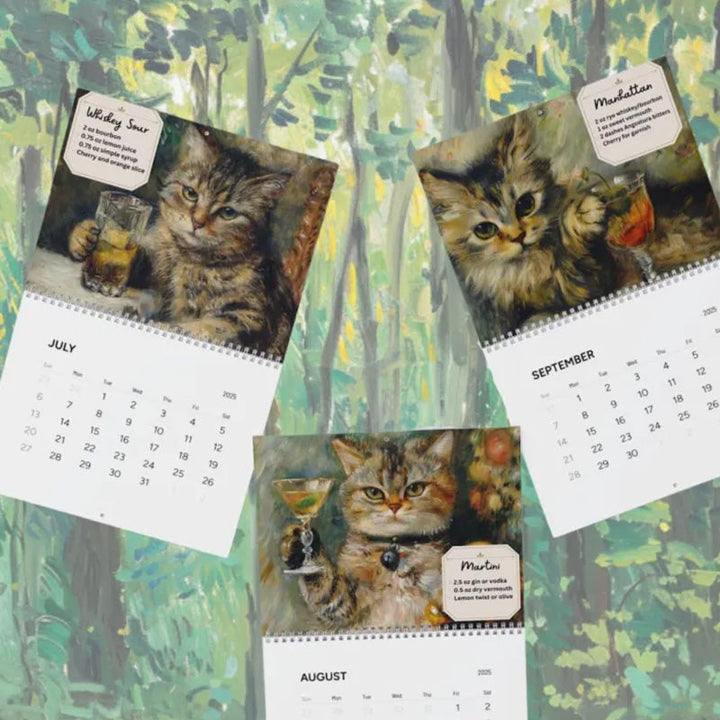 Open 2025 Feline Cocktail Calendar displaying a playful cat illustration with a cocktail, great unique gift
