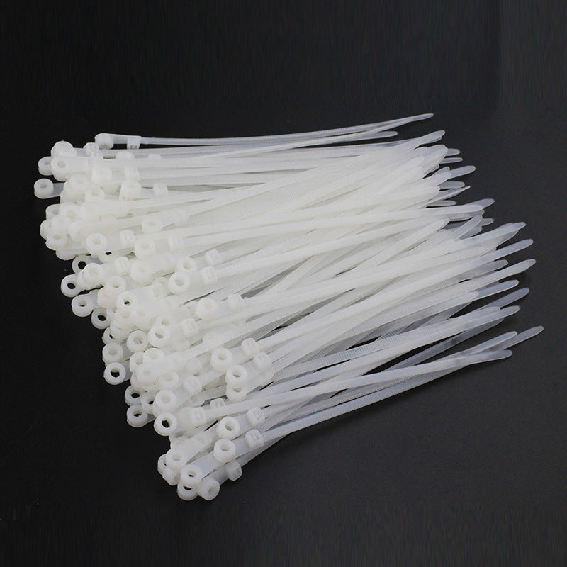 Diagram illustrating how to use self-locking nylon cable ties for secure wall-mounted cables