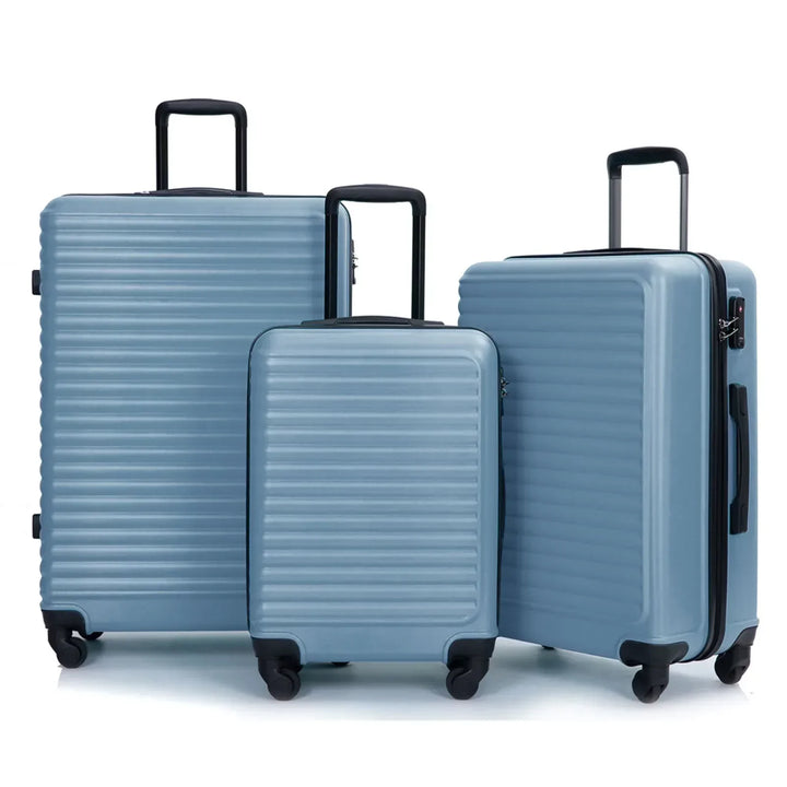 3-piece blue ABS hard shell travel luggage set with spinner wheels, perfect for vacation & business trips.