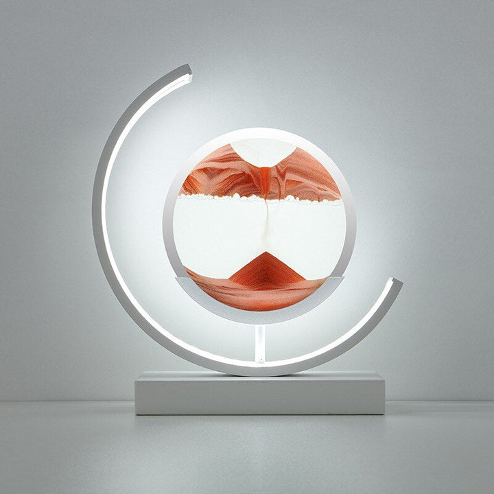 "3D Sand Shell Table Lamp emitting soothing green LED light; modern art-inspired design with dynamic sand patterns."