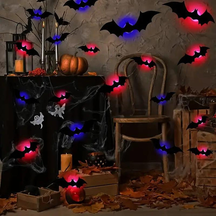 Collection of 3D bat LED decorations illuminated against a dark background, Halloween party decor