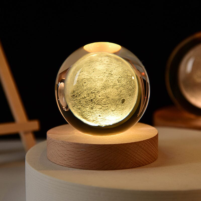 Warm illuminated 3D engraved crystal ball, a charming table lamp