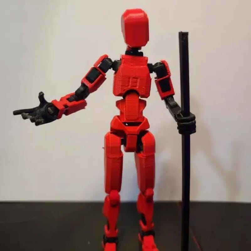 Desktop display of a 3D printed robot toy with movable joints, serving as unique desk decor