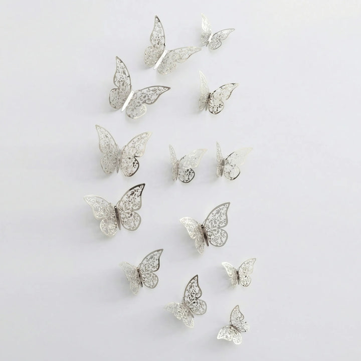 Elegant 3D wall butterflies in gold and silver, perfect home accents for a sophisticated living space.