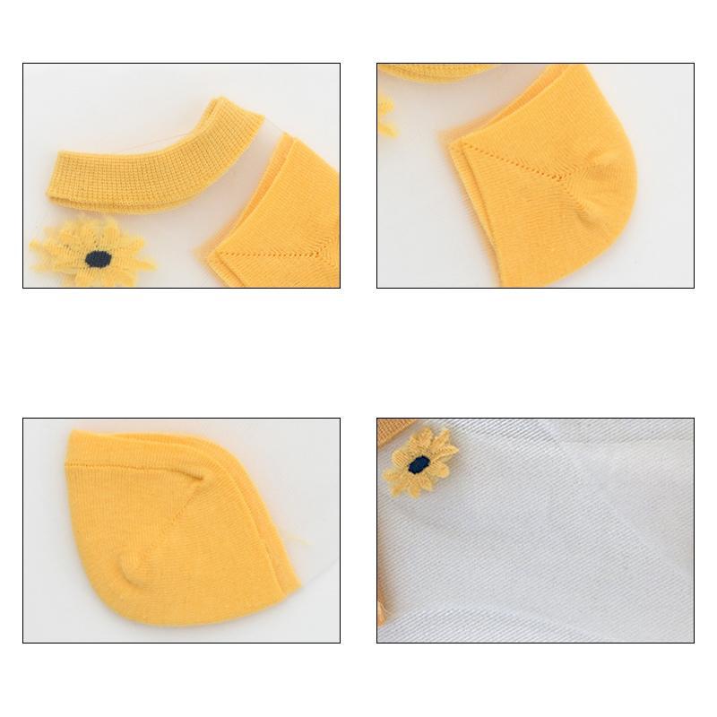 Top view of multiple women's floral daisy ankle socks, showcasing vibrant summer colors