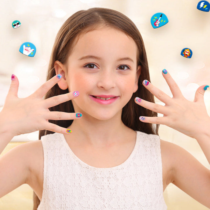 Macro shot of small, detailed animal nail art decals from the children's beauty sticker pack