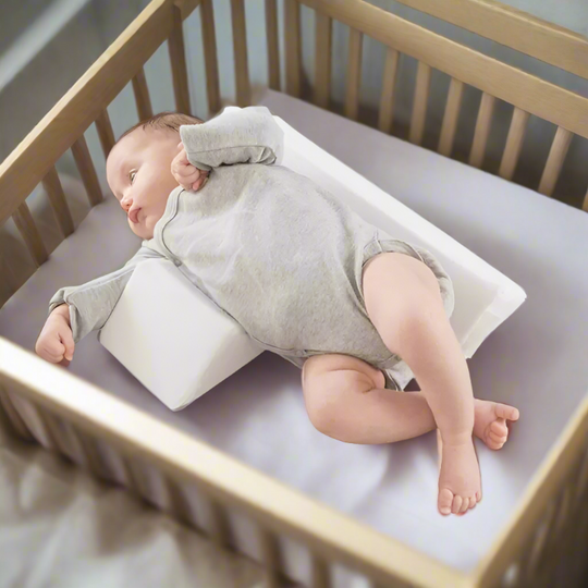 Anti-Roll Adjustable Memory Foam Baby Pillow in Pink, side-sleeper support, gentle and breathable design for newborns.