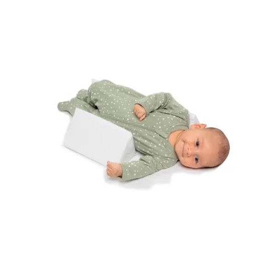 Anti-Roll Adjustable Memory Foam Baby Pillow in Pink, side-sleeper support, gentle and breathable design for newborns.