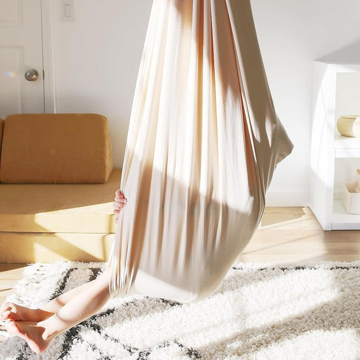 "Calming therapy hammock for children in soothing colors, enhances relaxation, emotional calmness, and motor skills."