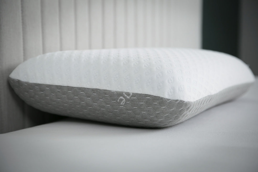 CarbonIce Pillow for all-season comfort with dual memory foam, featuring cooling tech and orthopedic design for restful sleep
