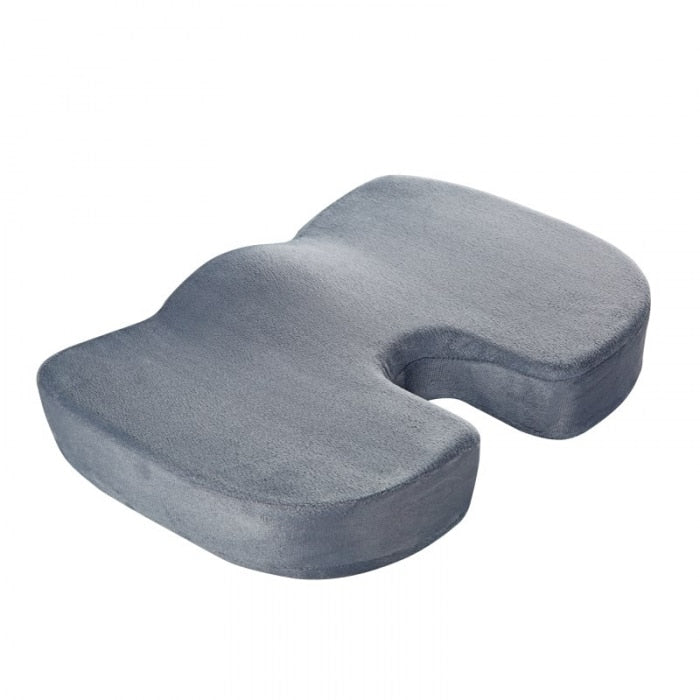 "Coccyx cushion with U-shape cutout, gray memory foam for tailbone pain relief, ergonomic design, enhances sitting comfort."