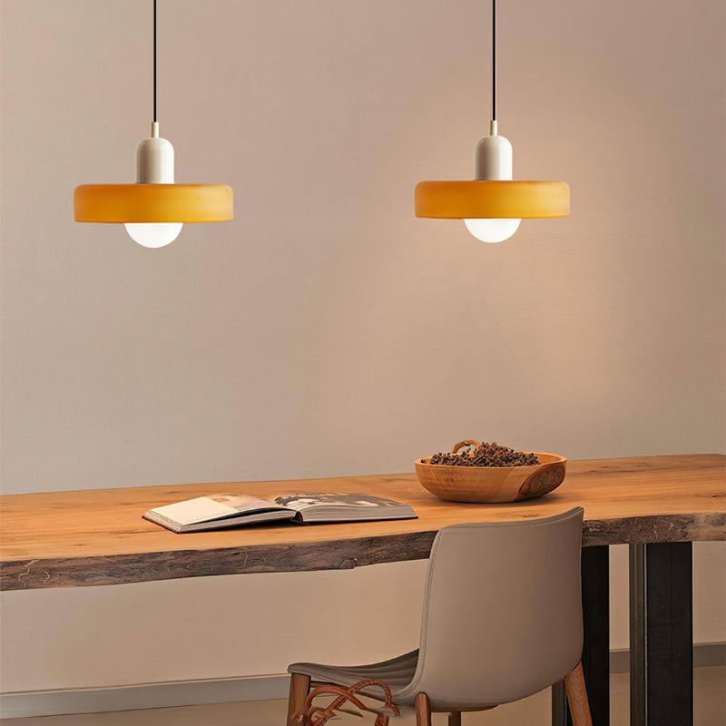 "Colourful glass pendant lamp in Bauhaus style featuring red, green, pink, and yellow stained glass for artistic decor."