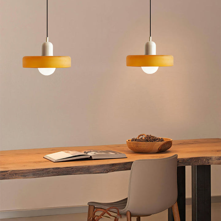"Colourful glass pendant lamp in Bauhaus style featuring red, green, pink, and yellow stained glass for artistic decor."