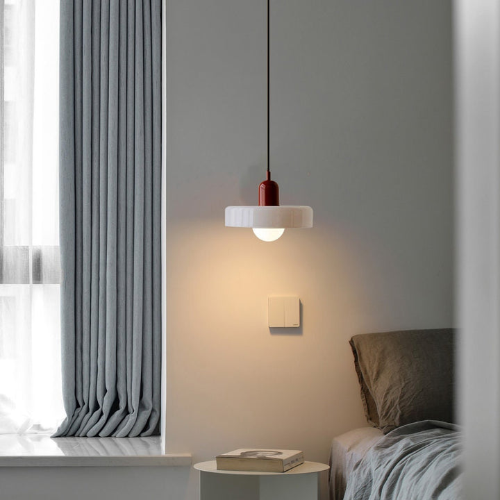 "Colourful glass pendant lamp in Bauhaus style featuring red, green, pink, and yellow stained glass for artistic decor."