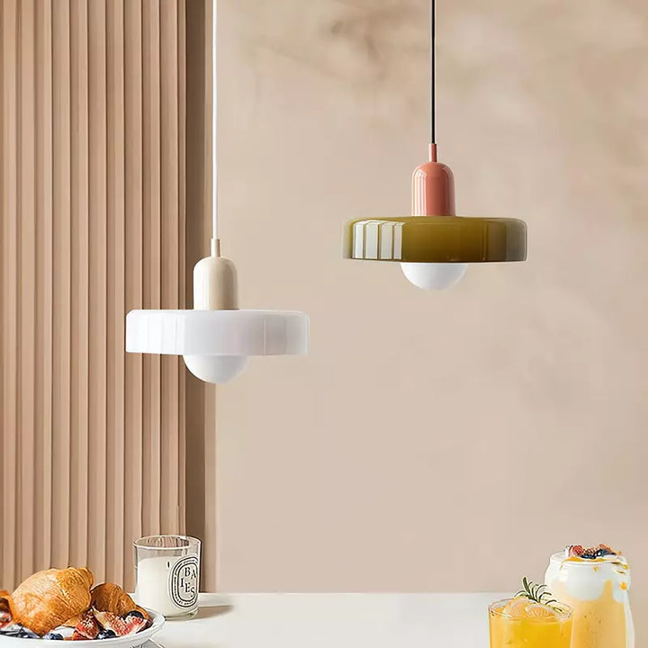 "Colourful glass pendant lamp in Bauhaus style featuring red, green, pink, and yellow stained glass for artistic decor."