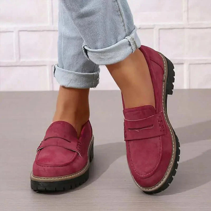 "Comfortable women's slip-on suede sandals showcasing soft suede texture and supportive sole for stylish all-day wear."