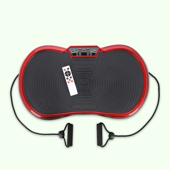Compact home vibration exercise platform in black with detachable resistance bands, non-slip surface, and remote control.