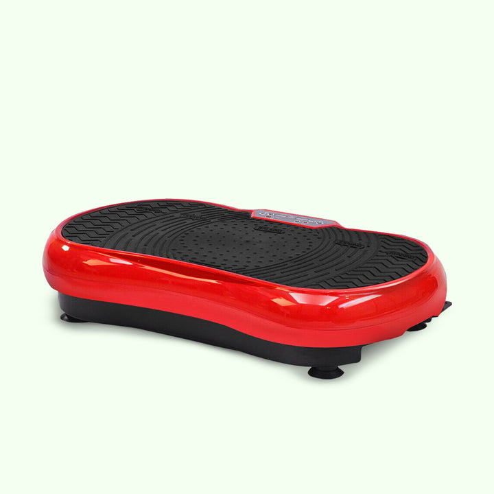 Compact home vibration exercise platform in black with detachable resistance bands, non-slip surface, and remote control.