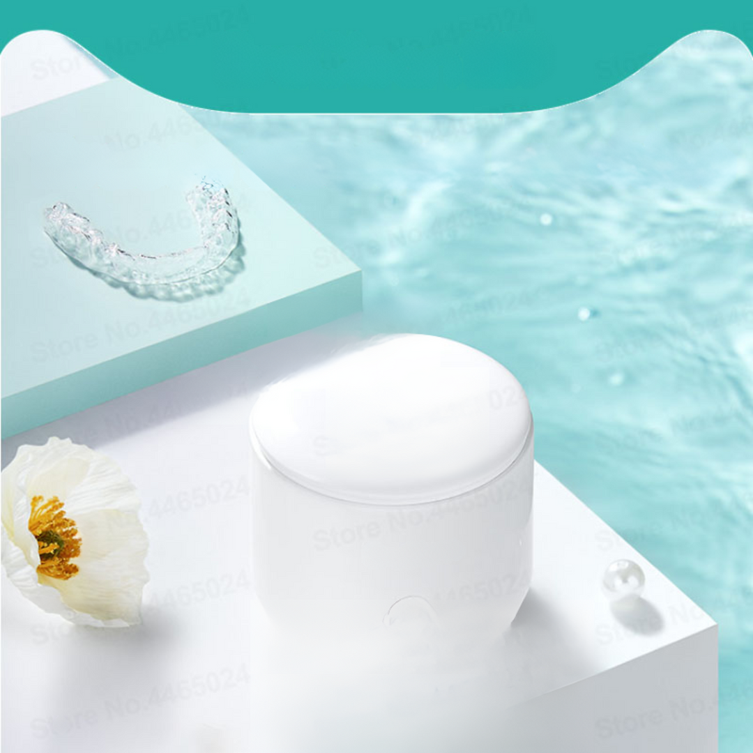 "Compact ultrasonic cleaner with UV lights, ideal for jewelry and watches, featuring a sleek design and deep cleaning technol