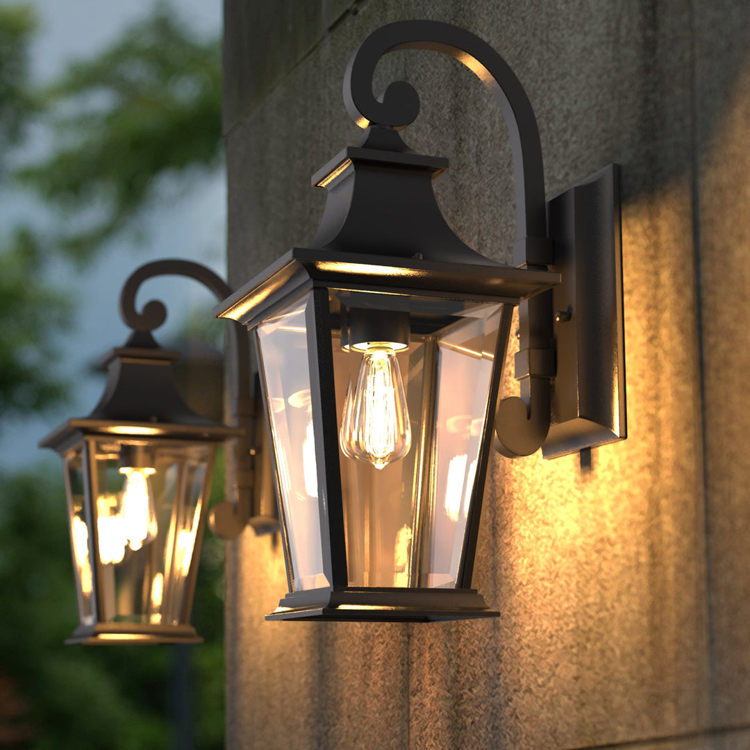 Elegant matte black outdoor wall light with glass shade, weatherproof; perfect for enhancing entrance ambiance and style.