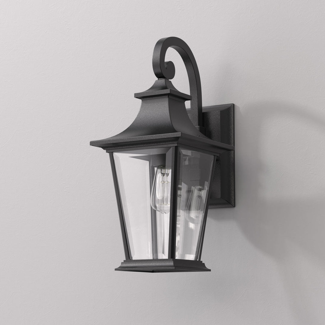 Elegant matte black outdoor wall light with glass shade, weatherproof; perfect for enhancing entrance ambiance and style.