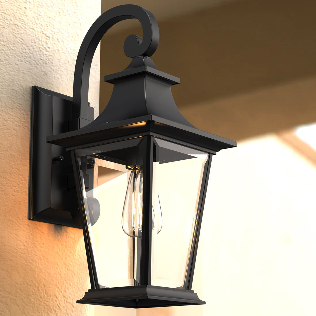 Elegant matte black outdoor wall light with glass shade, weatherproof; perfect for enhancing entrance ambiance and style.