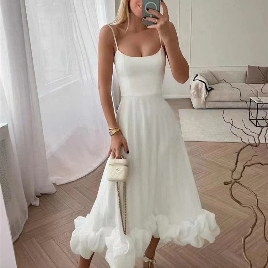 Elegant women's ruffled chiffon midi dress with spaghetti straps and ruffled hem, perfect for day and night.