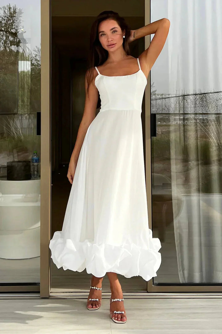 Elegant women's ruffled chiffon midi dress with spaghetti straps and ruffled hem, perfect for day and night.