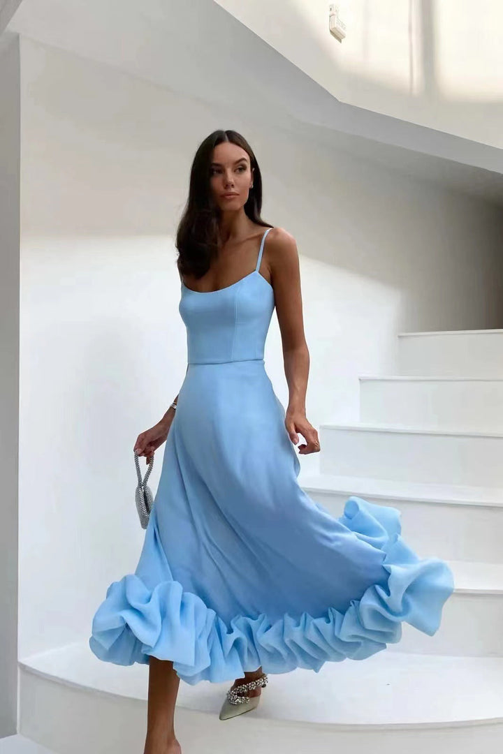 Elegant women's ruffled chiffon midi dress with spaghetti straps and ruffled hem, perfect for day and night.