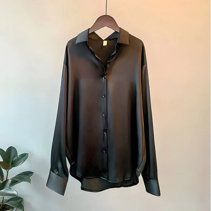 Elegant women's silk blouse with smooth texture; lightweight, versatile design in multiple colors. Perfect for any occasion.