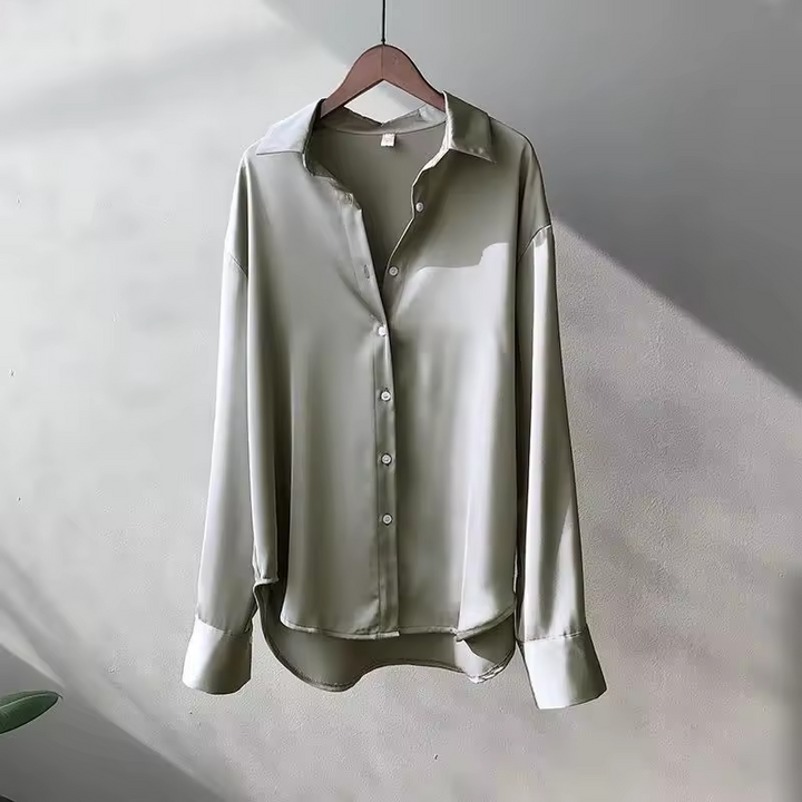 Elegant women's silk blouse with smooth texture; lightweight, versatile design in multiple colors. Perfect for any occasion.