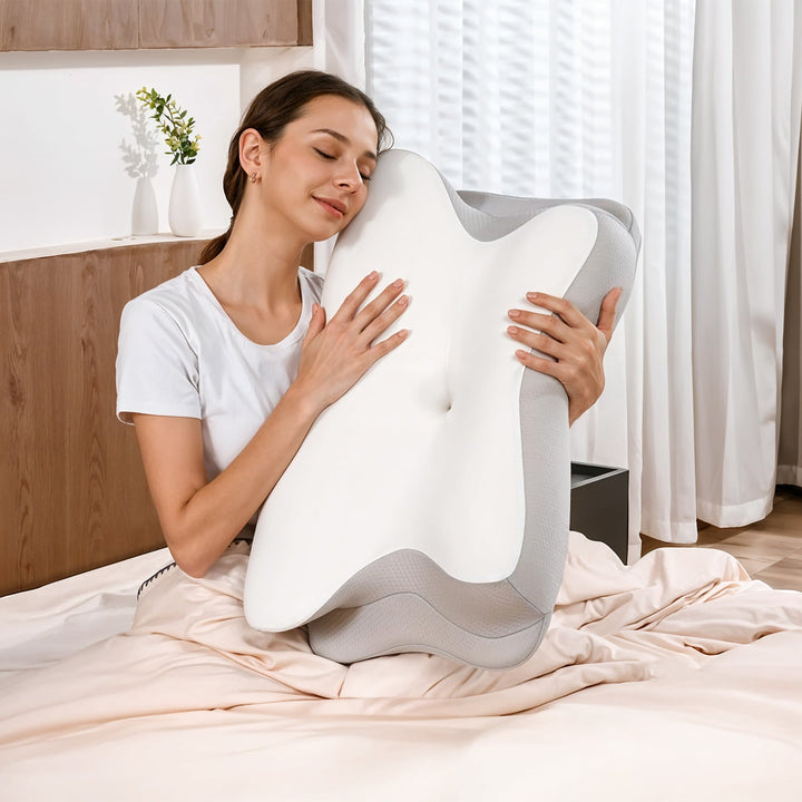 "Ergonomic butterfly-shaped memory foam pillow offering neck support, shown in stylish blue with breathable fabric design."