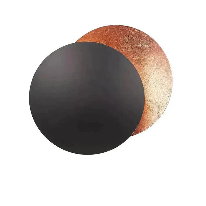 "Golden Solaris Wall Lamp with eclipse-inspired design, featuring elegant gold discs and warm LED glow for home decor."