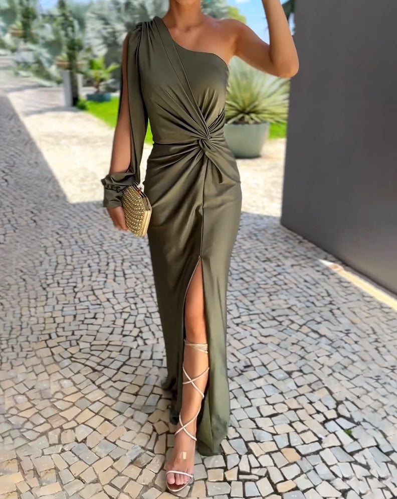 Green one-shoulder evening dress for women with open long sleeve, maxi length, and front slit, perfect for formal events.