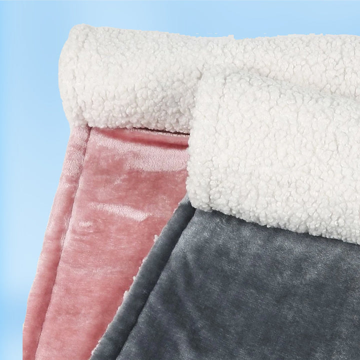 "Grey and pink flannel heated seat cushion, cozy and stylish, perfect for home, office, or travel comfort and warmth."