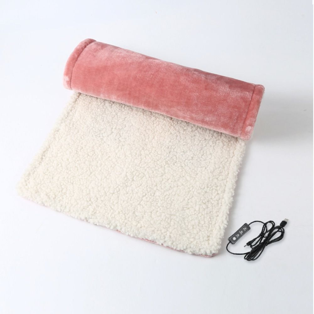 "Grey and pink flannel heated seat cushion, cozy and stylish, perfect for home, office, or travel comfort and warmth."
