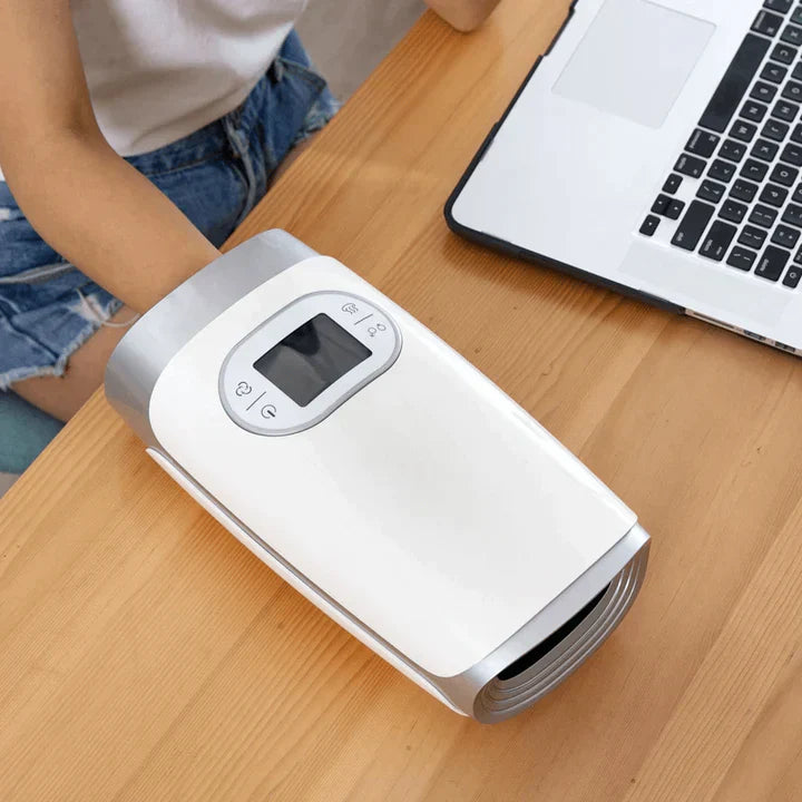 "Hand massager with heat and compression, beige, offers versatile relief with acupressure for hand wellness and relaxation."