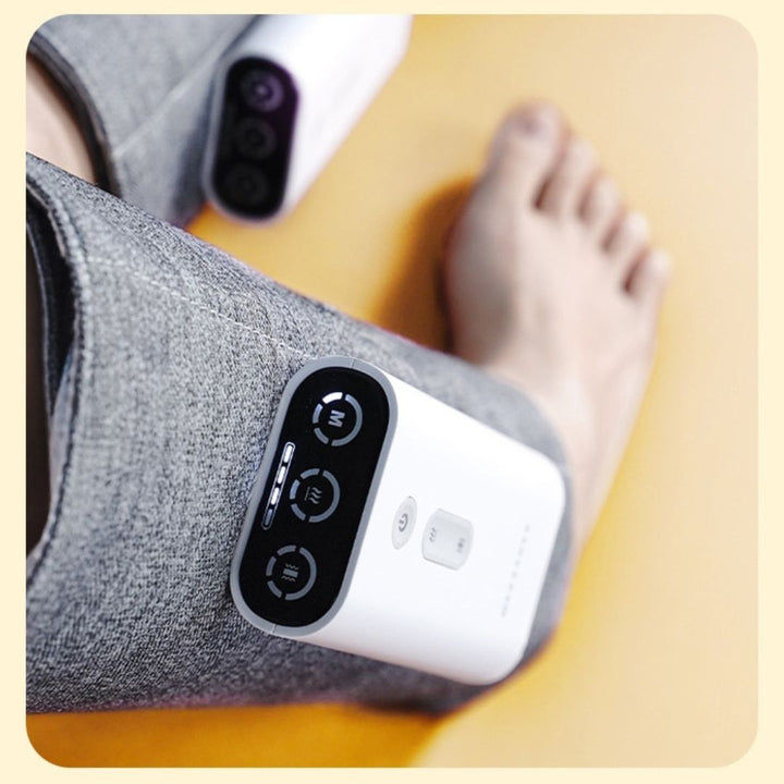"Heated leg massager wraps around calves and ankles, shown in use. Provides soothing heat and customizable massage for relaxa