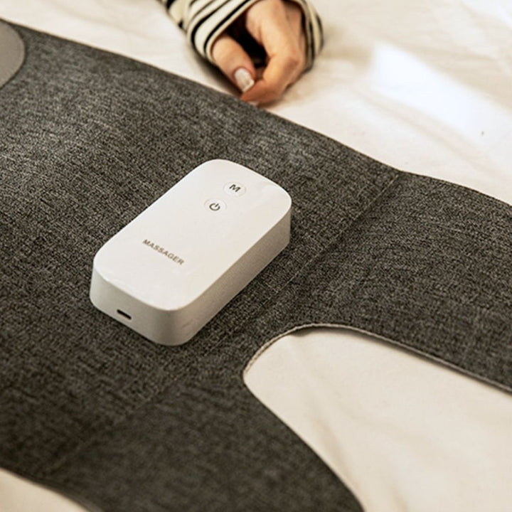 "Heated leg massager wraps around calves and ankles, shown in use. Provides soothing heat and customizable massage for relaxa