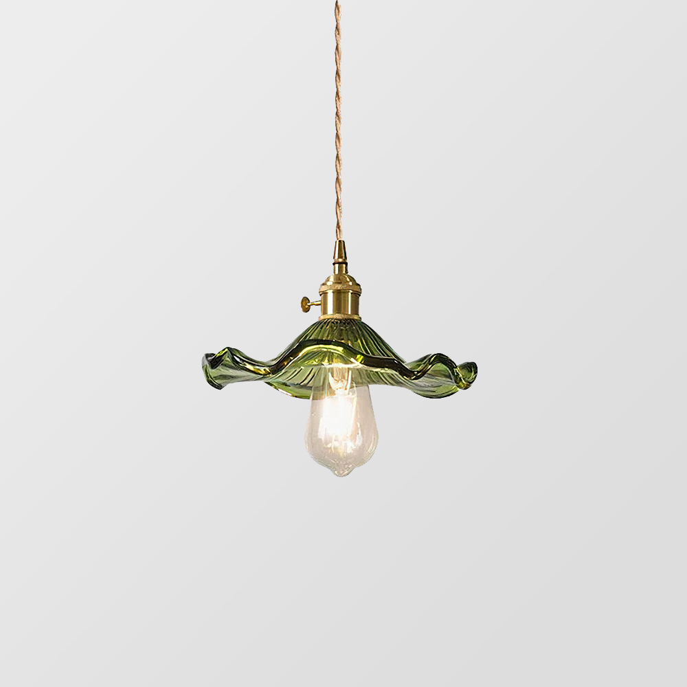 "Hibiscus flower-shaped pendant light in brass and glass, adds elegance and vibrancy to stylish room decor."