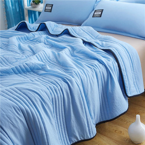 "Ice Cooling Blanket, breathable, moisture-wicking, in soothing blue, green, pink, grey colors, for comfortable sleep."