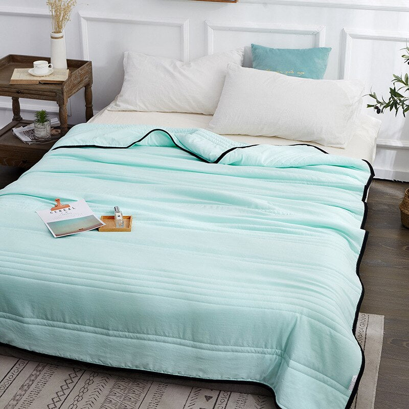 "Ice Cooling Blanket, breathable, moisture-wicking, in soothing blue, green, pink, grey colors, for comfortable sleep."