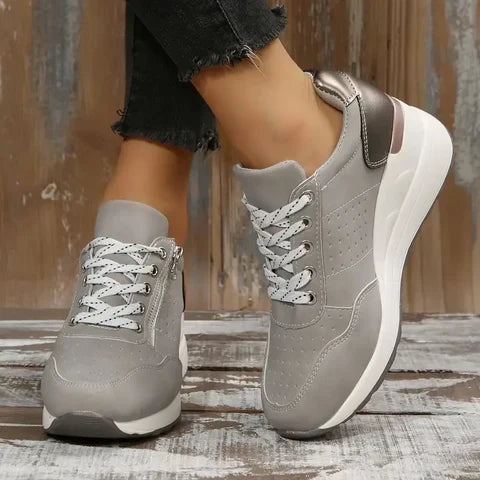 "Isabella women's orthopaedic walking shoes with ergonomic design, seen in gray, offer arch support and cushioning comfort."
