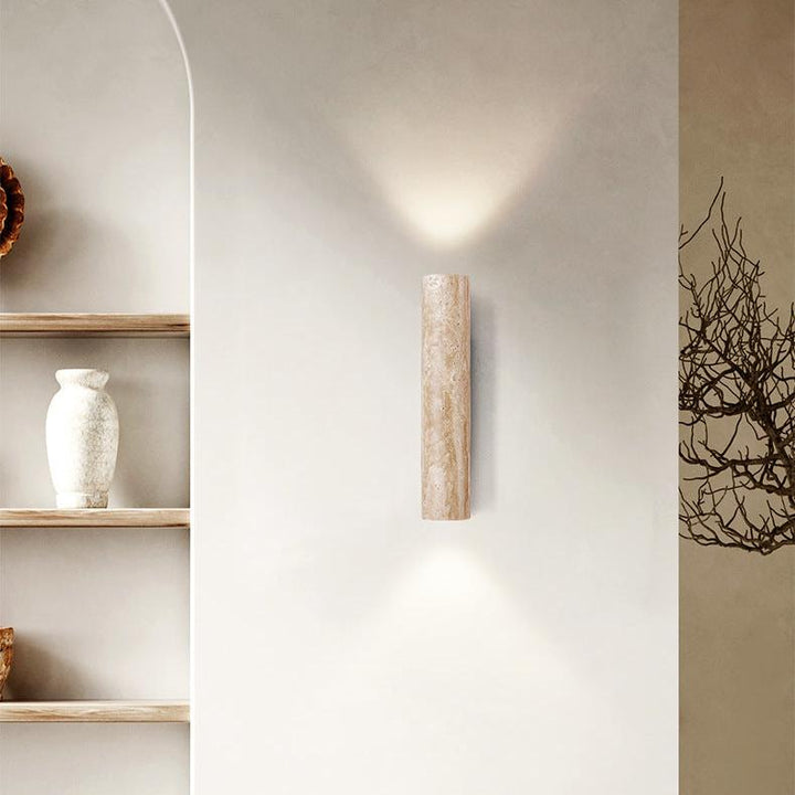 Japandi minimalist travertine stone wall lamp with natural beige finish, conveys elegance with its sleek design and warm glow
