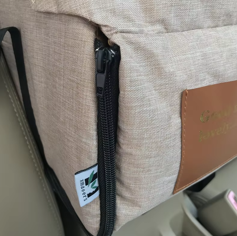 "Luxe padded dog car seat with safety belt, portable for travel, ensuring comfort and security during car journeys."