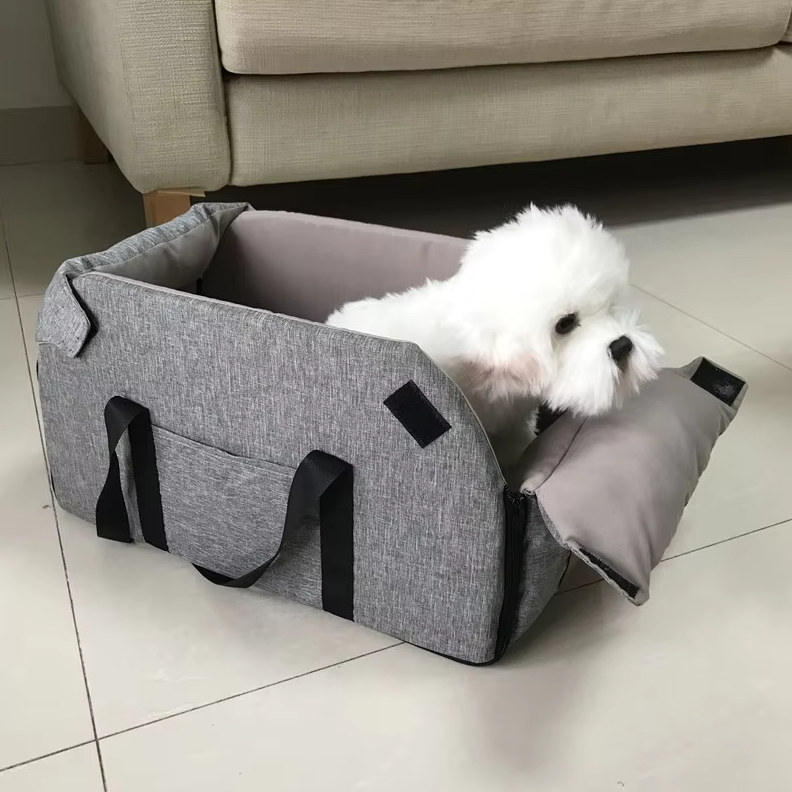 "Luxe padded dog car seat with safety belt, portable for travel, ensuring comfort and security during car journeys."
